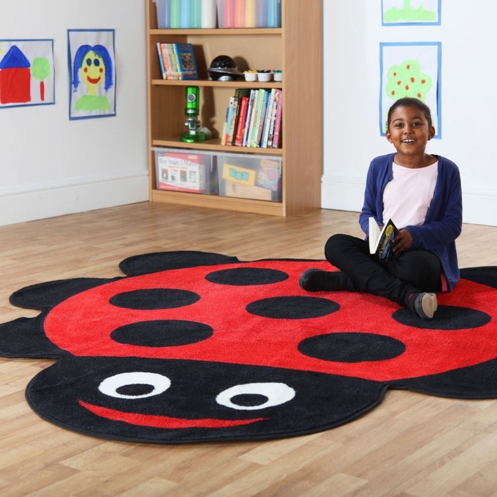 Back to Nature Ladybird Carpet, This highly colourful Back to Nature Ladybird placement carpet is great for reading areas or just a bright addition to the classroom or nursery environment. The Back to Nature Ladybird Carpet is a colourful character that will bring learning areas to life with colour and style. The giant shaped ladybird is ideal for use in classroom reading corners or play areas. The bright classroom rug is distinctive, fun and has been designed with comfort in mind. The easy clean, anti-stai