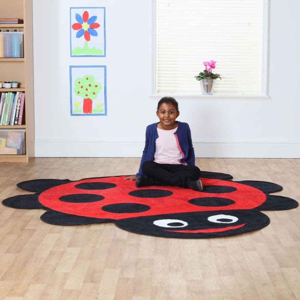 Back to Nature Ladybird Carpet, This highly colourful Back to Nature Ladybird placement carpet is great for reading areas or just a bright addition to the classroom or nursery environment. The Back to Nature Ladybird Carpet is a colourful character that will bring learning areas to life with colour and style. The giant shaped ladybird is ideal for use in classroom reading corners or play areas. The bright classroom rug is distinctive, fun and has been designed with comfort in mind. The easy clean, anti-stai