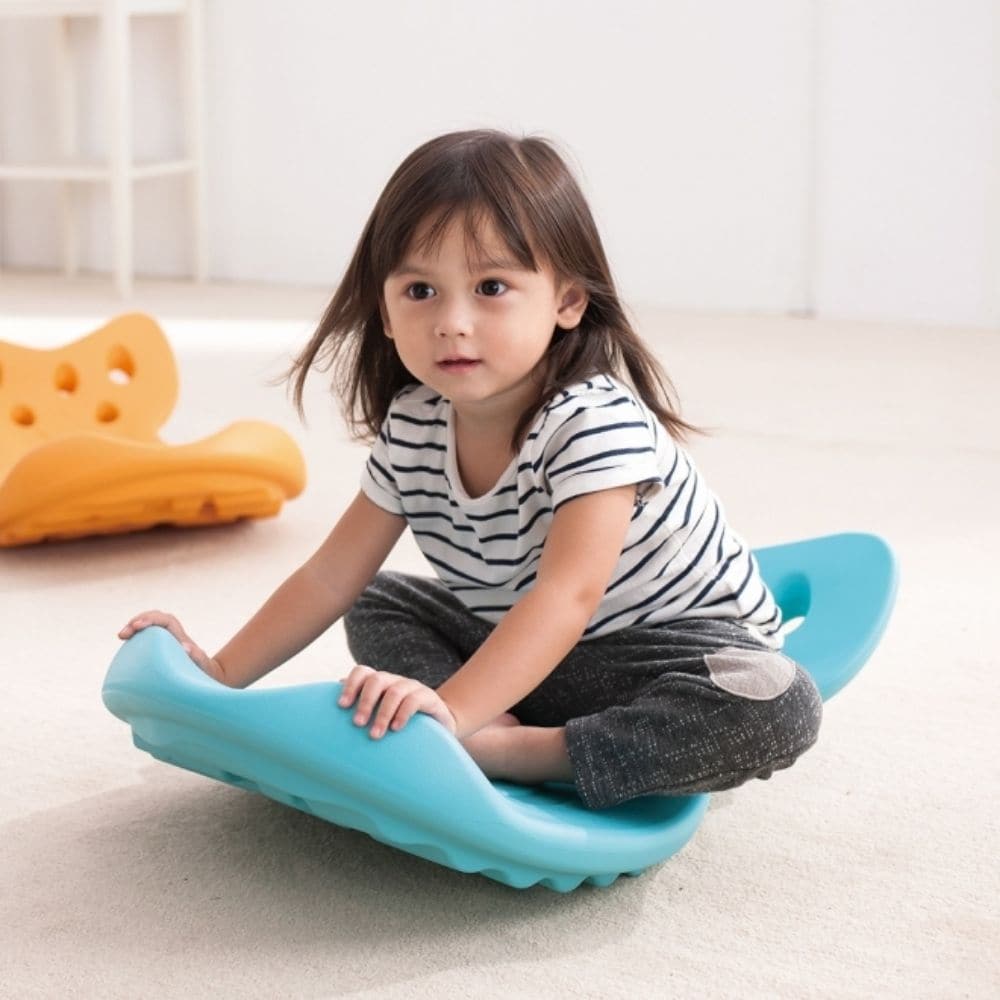 Balance Rocking Whally Board, The WePlay® Whally Board is a fun balance board for kids! The Weplay Whally Board is inspired by a jumping fish, The Weplay Whally Board is textured with waves and bubbles on the surface to provide children with tactile stimulation's to feet and inspire the imagination of fish roaming freely in water. This ergonomic Whally balance board is designed for young children to either sit in or stand on for a fun rock balancing game. Special Play values: – Playing on the top side of We