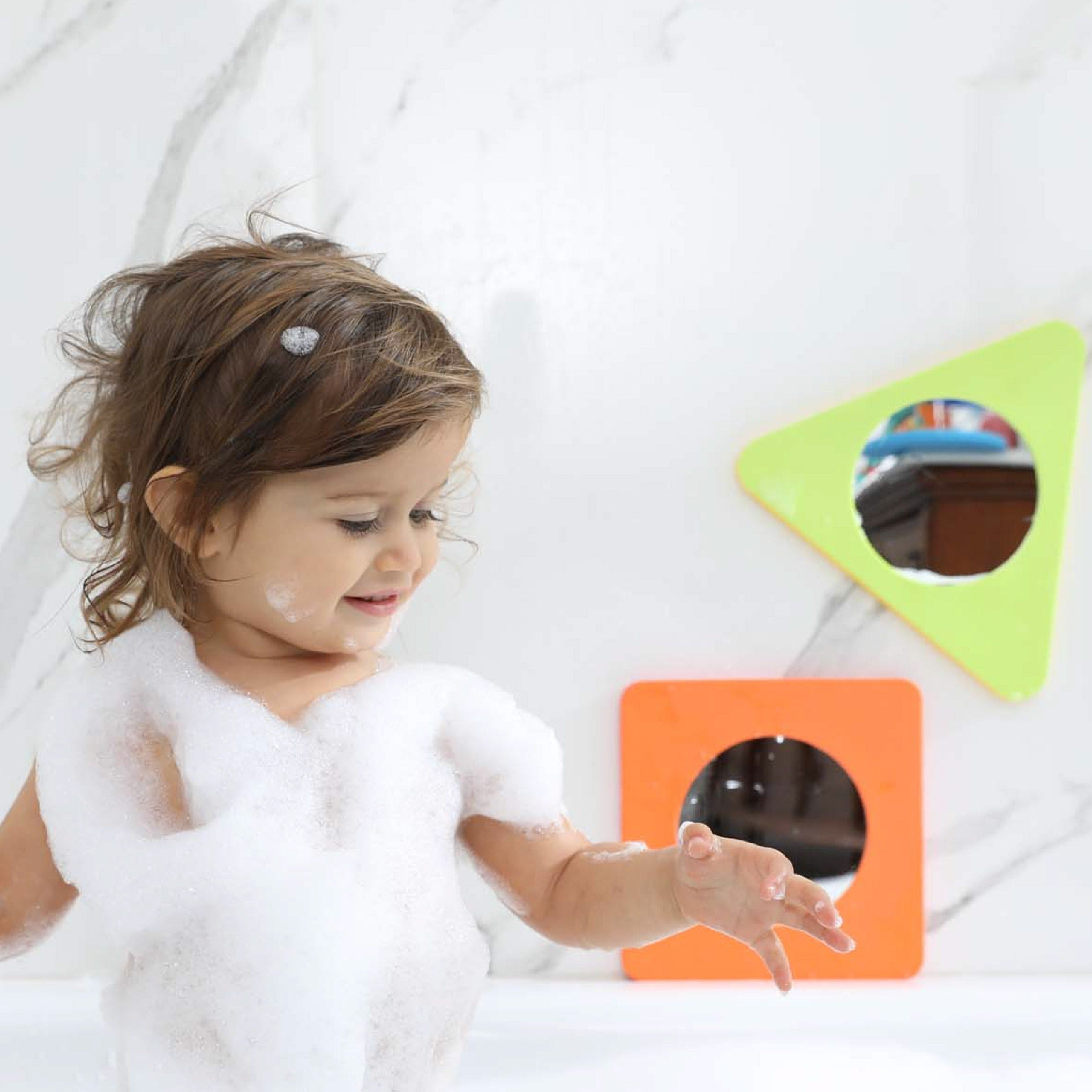 Bath Mirror Shapes, Looking for a fun and educational bath time activity for your little ones? Look no further than these Bath Mirror Shapes from Edufoam! Featuring three brightly coloured mirrors in triangle, circle, and square shapes, these toys are designed specifically for water play and will stick to any smooth, flat surface when wet.Made from Edufoam, these mirrors are incredibly durable and resistant to mould and mildew. They won't absorb water or become misshapen, ensuring that your child will enjoy
