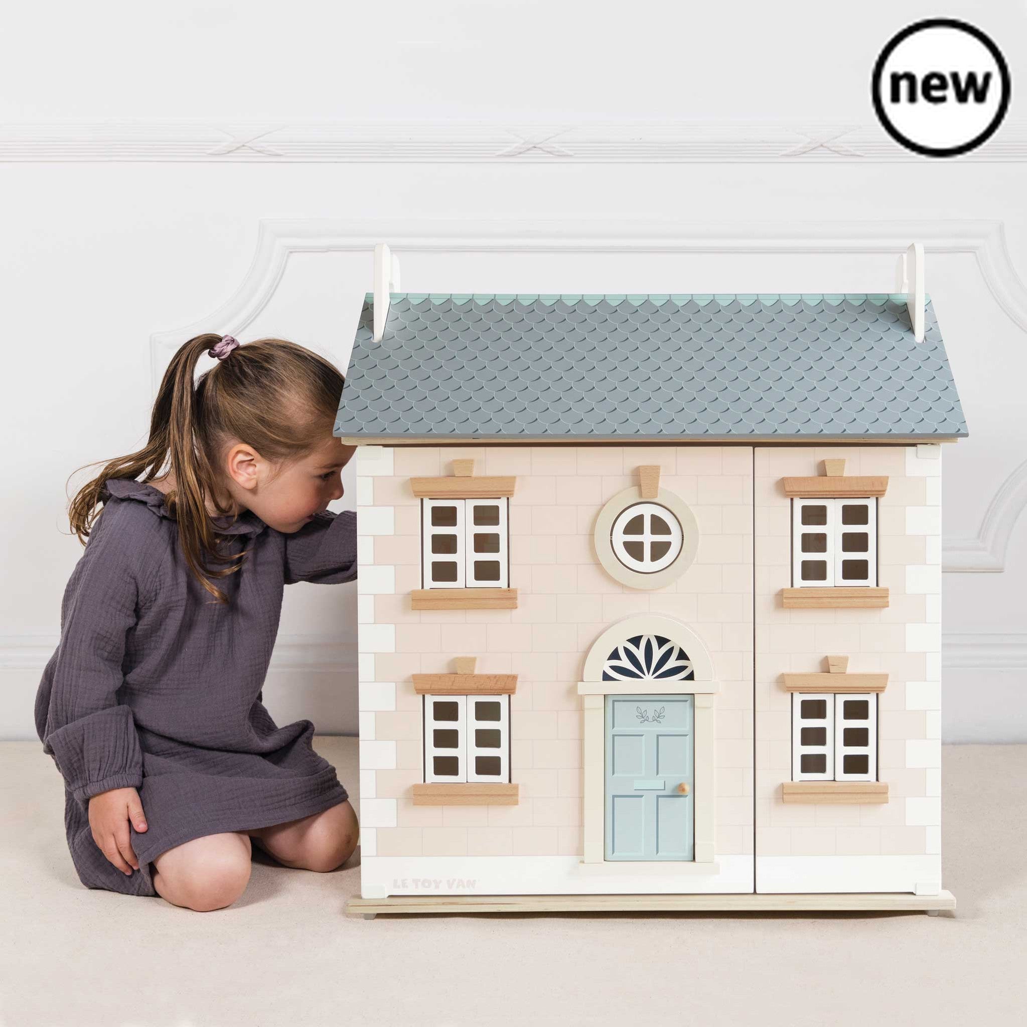 Bay Tree Dolls House, Childhood dreams really do come true with the beautiful Bay Tree Wooden Dolls House. Inspire small world play with this one of a kind, timeless toy. Made from sustainable FSC™- certified wood and painted in pretty pastel pink, white and grey hues using non-toxic water based paints, this deluxe 3 storey home is fully decorated inside and out. Featuring opening and closing shutters and doors, natural wood floors throughout, a lovely wooden staircase to the first floor and a detailed wall