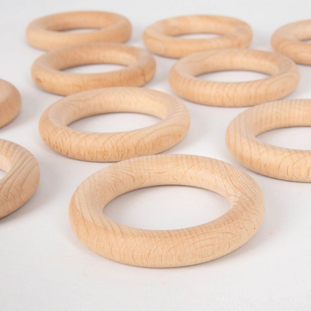 Beechwood Rings Pack of 10, Designed to open up a new world of discovery and play, this 56mm Pack of 10 Beechwood Rings is ideal for igniting the imagination in toddlers. Designed for heuristic play which is rooted in children's natural curiosity, these simple wooden Beechwood Rings create a treasure trove of play ideas that help to develop their playing and cognitive skills. Allow children to feel, pair, stack and loop these beechwood rings again and again and you'll help to develop an open environment whe