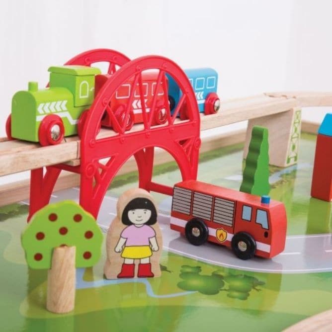 BigJigs Services Train Set and Table, The Services Train Set and Table is an all-in-one play station designed to captivate young minds and encourage imaginative play. Made from high-quality, responsibly sourced materials, this wooden train set and table combo is both durable and safe, adhering to current European safety standards. One of the standout features of this BigJigs Services Train Set and Table set is the raised table, which allows for easy accessibility to all parts of the train network. This rais