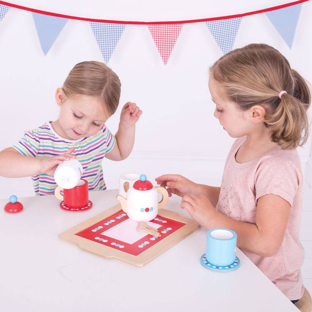 BigJigs Tea Set on a Tray, This delightful BigJigs Tea Set on a Tray comes with everything they need to host the perfect tea party, including a teapot with lid, two wooden cups and saucers, a sugar pot with lid, two wooden spoons, a milk jug, and a tray. Kids will love pouring imaginary tea and serving up imaginary treats with this charming set.Not only is it fun to play with, but the Bigjigs Toys Wooden Tea Set is also a great way to encourage imaginative play and develop social skills. Kids can practice s