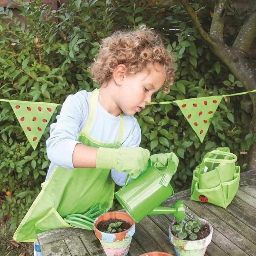 Bigjigs Toys Green Watering Can, The Bigjigs Toys Green Watering Can is the perfect companion for lively young gardeners who want to help Mum and Dad water the plants. Designed with little hands in mind, this watering can features both a top and side handle, making it easy for children to hold and pour water. With its fixed spout, this watering can is efficient and convenient, ensuring water goes exactly where it needs to go. Kids will love feeling involved in the gardening process and learning about the im