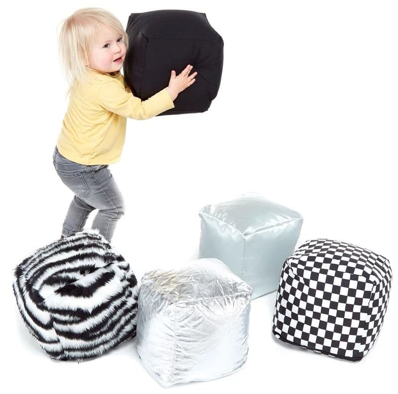 Black and White Soft Cubes, Introducing our delightful set of 5 Black and White Sensory Soft Cubes, carefully crafted to cater to the developmental needs of young children. Each cube in this exquisite set carries its own unique surface and design, encouraging little ones to explore and investigate the wonders of tactile play. Let’s delve into the finer details of this product that promises not only fun playtime but also nurtures a strong developmental foundation for your child: Black and White Soft Cubes De