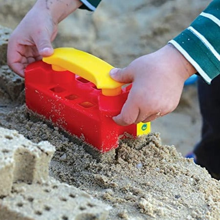 Brick Shaper, This Brick Shaper from Gowi Toys is ideal for use in the sandpit or on the beach. The perfect sand toy, fill it up to the brim with sand, press down and lift off to reveal the sand brick. What will you build today? A giant sandcastle fort? A house? A pirate ship? A spaceship? The possibilities are endless! The Gowi Toys Brick Shaper is made from colourful, sturdy plastic. The bright colours help encourage early childhood development. Brick Shaper product features Ideal for playing in the sandp