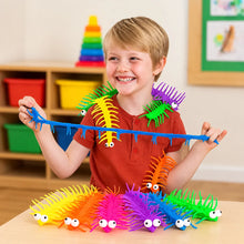 Child stretching a blue centipede toy with colourful centipede toys on a table