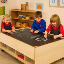Chalkboard and dry wipe table in an early years classroom