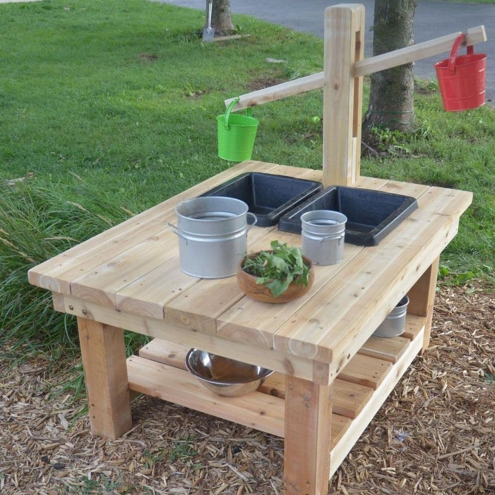 Childrens Wooden Water Outdoor Play Unit, The Children’s Wooden Weights and Scale Table is great for outdoor mathematical learning! The Children’s Wooden Weights and Scales Table is a robust, hard-wearing and educational resource. Removable wet play bowls and scales allow children to weigh and measure outdoor natural resources. Early years learn to estimate, predict, compare, contrast and evaluate different materials as they play. As well as experiencing different textures, they begin to understand the conc