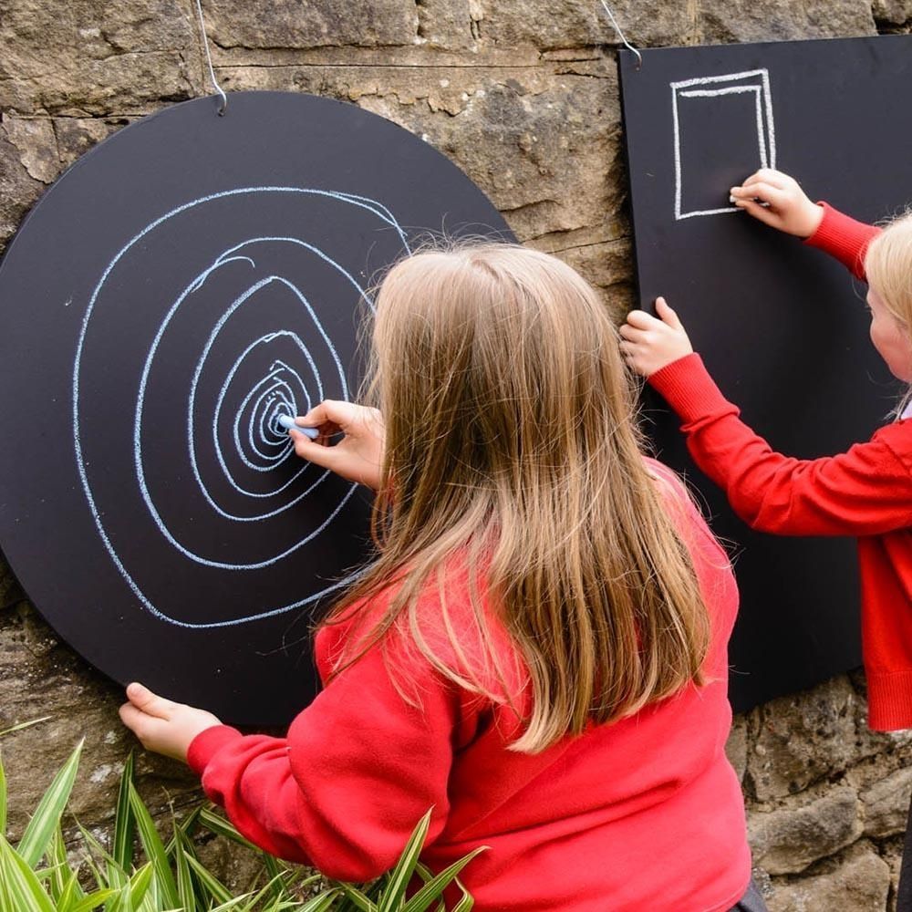 Circular Chalkboard, The Circular Chalkboards are coated in several layers of high quality chalkboard paint giving it that authentic matte finish. Usable with chalks and chalk pens (not included). These circular Chalkboards can be fixed to the wall, using the pre-drilled holes, enabling desired position. Suitable for Indoor/outdoor use. Create themed/zoned/role play areas, explore Maths or Literacy outdoors, create signs around your outdoor area, create signs inside around the school building or write impor