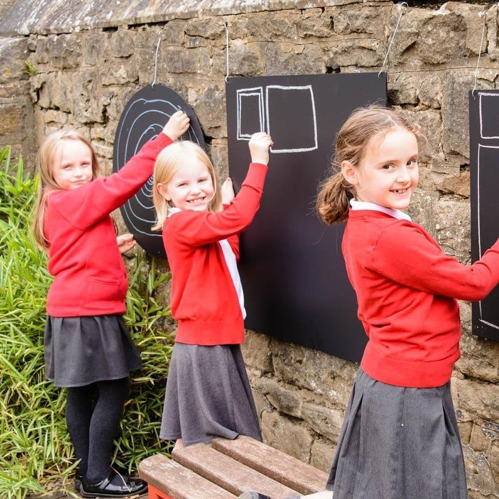 Circular Chalkboard, The Circular Chalkboards are coated in several layers of high quality chalkboard paint giving it that authentic matte finish. Usable with chalks and chalk pens (not included). These circular Chalkboards can be fixed to the wall, using the pre-drilled holes, enabling desired position. Suitable for Indoor/outdoor use. Create themed/zoned/role play areas, explore Maths or Literacy outdoors, create signs around your outdoor area, create signs inside around the school building or write impor