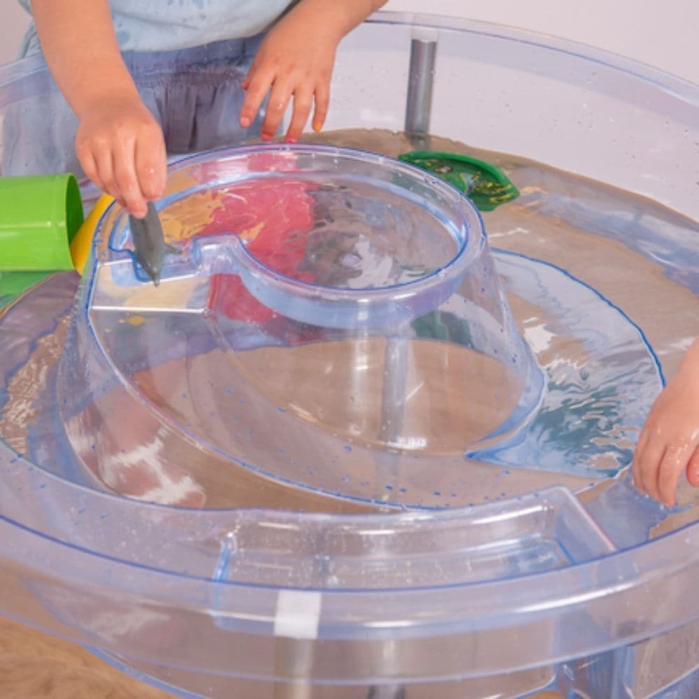 Circular Water Tray and Stand, The Circular Water Tray and stand set is a cleverly designed and versatile clear sand and water tray with central helter skelter for use as a water channel or roadway and an outer trough which together stimulate imaginative play. The Circular Water Tray and stand is beautifully designed and versatile clear sand and water tray with central helter-skelter for use as a water channel or roadway and an outer trough which together stimulate imaginative play.The Circular Water Tray a