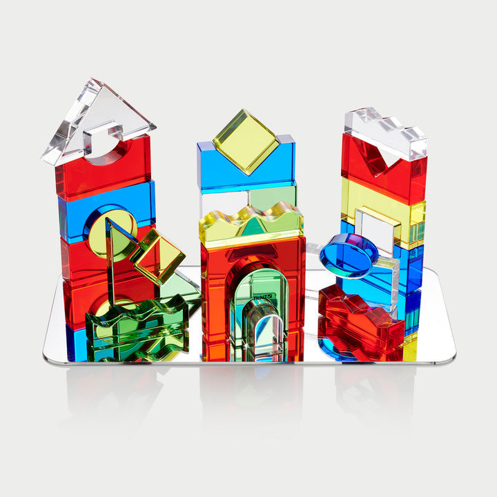 Colour Acrylic Block Set Pack of 25, Does your child love to build and construct fascinating towers and structures? Then they will love our TickiT Colour Crystal Block set consisting of a selection of polished translucent colour acrylic blocks. The Colour Acrylic Blocks have smooth and tactile surfaces designed to enable children to build patterns, sequences and structures as well as promoting key areas of development: Create regular polygons to help with mathematical language and the understanding of shape