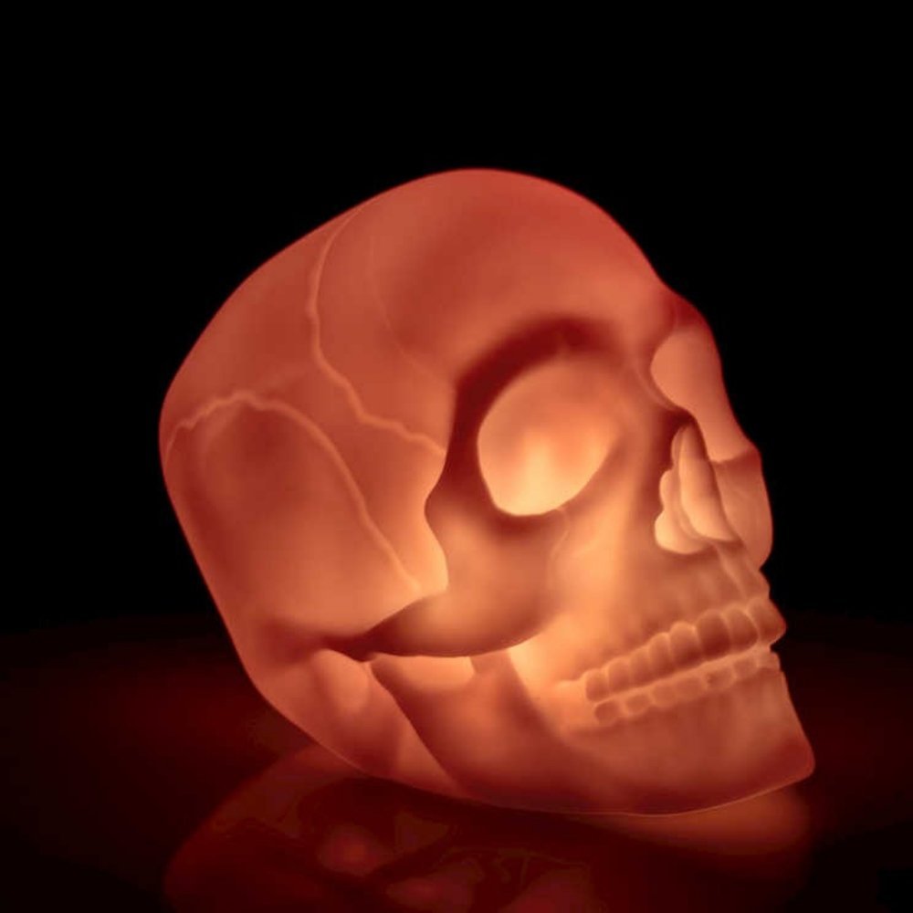 Colour Change Skull Light, Colourful lighting with a gothic twist, this Colour Change Skull Light adds a touch of drama to your space! Battery operated, this mini mood lamp is just the right size for desk tops providing a welcome distraction from screens, it's gently scrolling colours giving a relaxing back drop to your work, or it can be popped on the bedside table of older kids and teens to give a colourful twist to bedtime. Colour Change Skull Light With a simple on/off function, this colourful skull lam