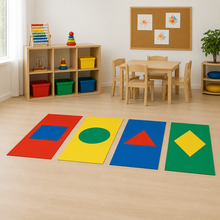 Four printed shape floor mats in a nursery
