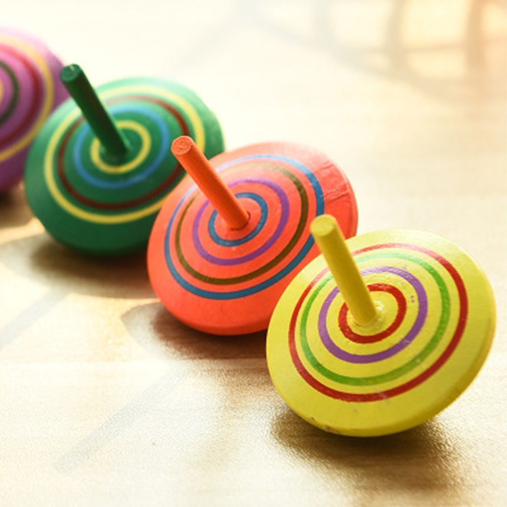 Colourful Spinning Top, These brightly coloured Spinning Tops are ideal stocking fillers or party bag treats and are perfectly sized for little hands. The Colourful Spinning Tops also helps to develop dexterity and co-ordination. The Colourful Spinning Tops are made from high quality, responsibly sourced materials. They are all brightly coloured, sturdily made and ideally sized for little hands. Great pocket money toys and party bag fillers, One supplied in random colour Suitable for 3+ years. Conforms to c