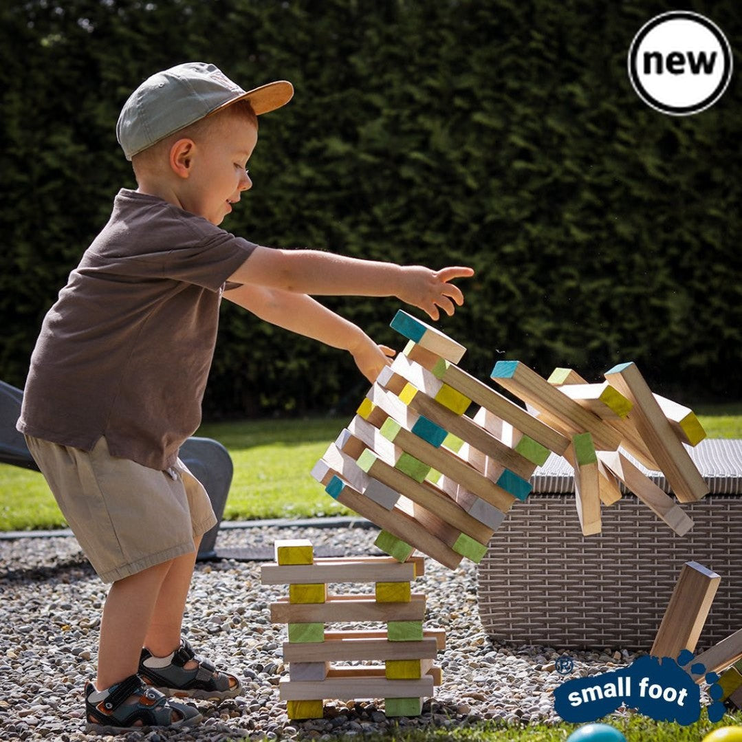Colourful Wobbly Tower, Introducing our Colourful Wobbly Tower, the game that will make your hands shake and your heart race! This 60-piece dexterity game, made with FSC® 100%-certified wood, is perfect for outdoor playtime. The objective is simple but challenging - players must have a steady hand and carefully pull individual blocks out of the tower without causing it to topple over. What sets this game apart is the inclusion of a colored die, adding an exciting twist to the gameplay. The die determines wh