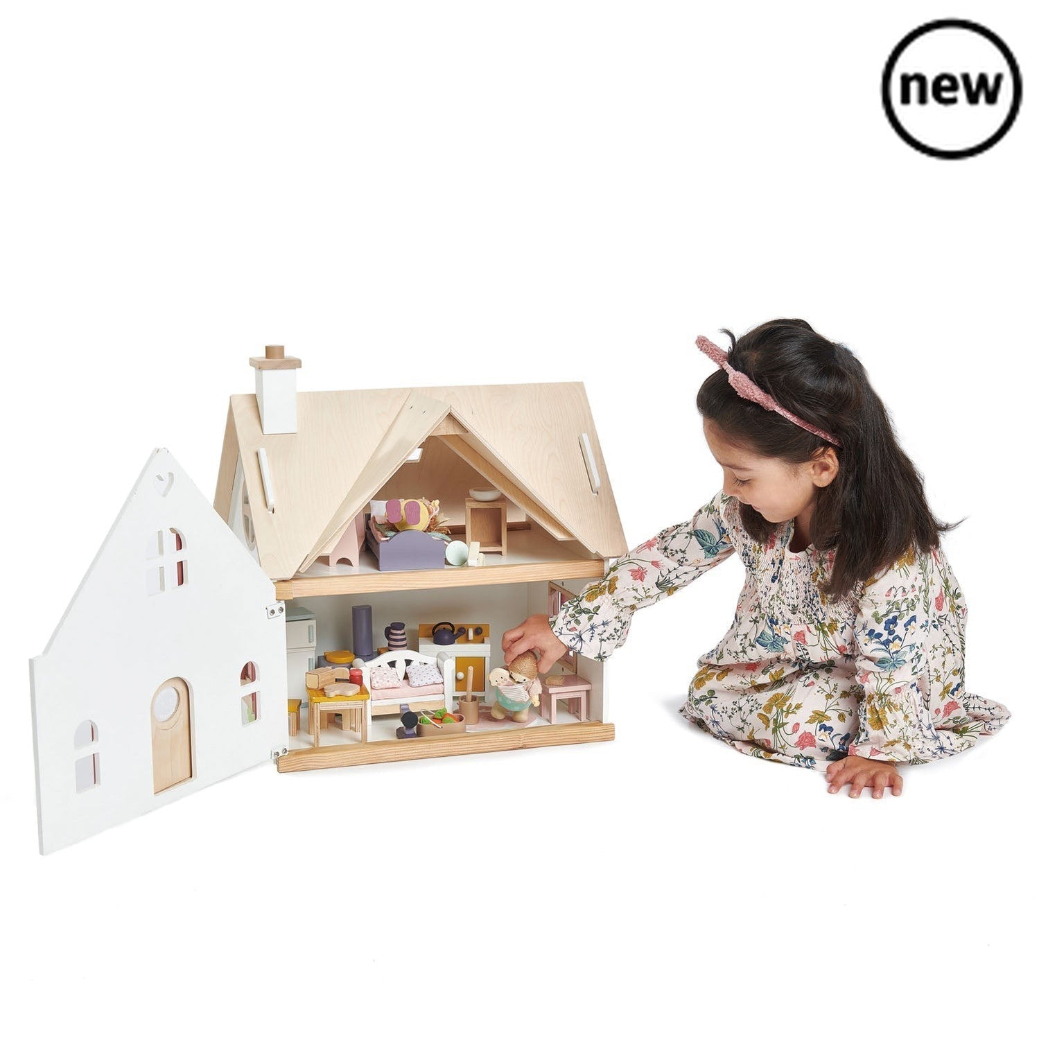 Cottontail Cottage + Furniture, The Cottontail Cottage Wooden Doll's House may just be your idea of a perfect home! This gorgeous wooden doll's house brings traditional play right into the heart of the home with everything you need to get started. This grand detached cottage is a playground for rabbits, who feature on the front of the house and are looked after with a big bowl of carrots to keep them happy. With a stylish room in the roof and a front that hinges open to reveal all the life inside, this is a