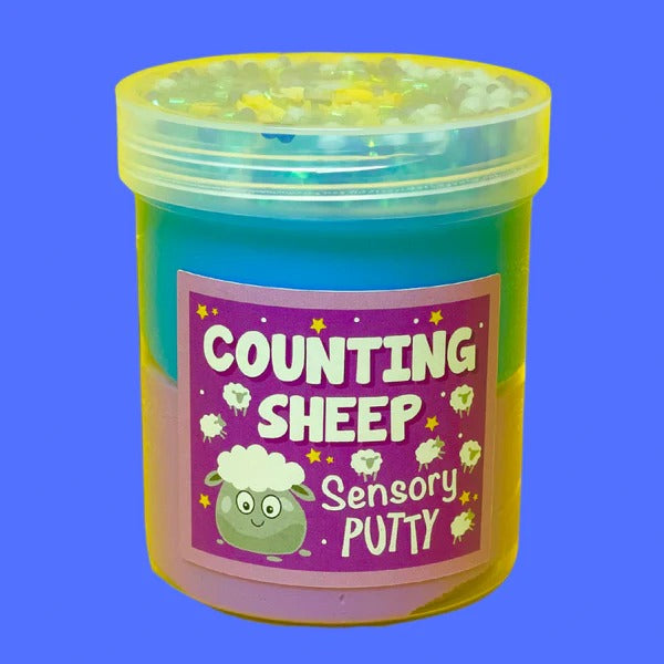 Counting Sheep Putty, Our Counting Sheep putty is our most relaxing putty by far! Gently scented with a soothing sweet blend and topped with blue floam beads, shimmering blue bingsu beads and a mixture of dreamy moon and star sprinkles, this combo of blue and purple putty creates the perfect way to wind down after a long day. Putties are air reactive and will dry out of left out. Always return to the container after play with the lid tightly on. Keep away from direct sunlight. Keep away from fabrics and por