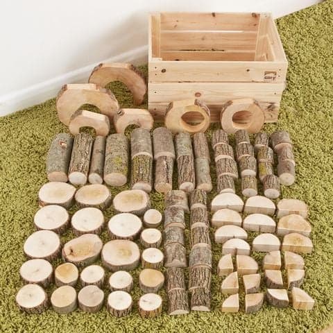 Crate constructa (90PK), This natural building block set comes in a rustic box, great for storage. Variation of wooden discs, sticks, doors and windows ideal for construction. The perfect enhancement to construction and small world play. This charming log block set offers a variety of shapes and sizes to help create everything from a jungle tree house to a fairy palace while maintaining the original grain and sensory feel of the wood. The Crate constructa provides a variation of wooden disks, windows, half 