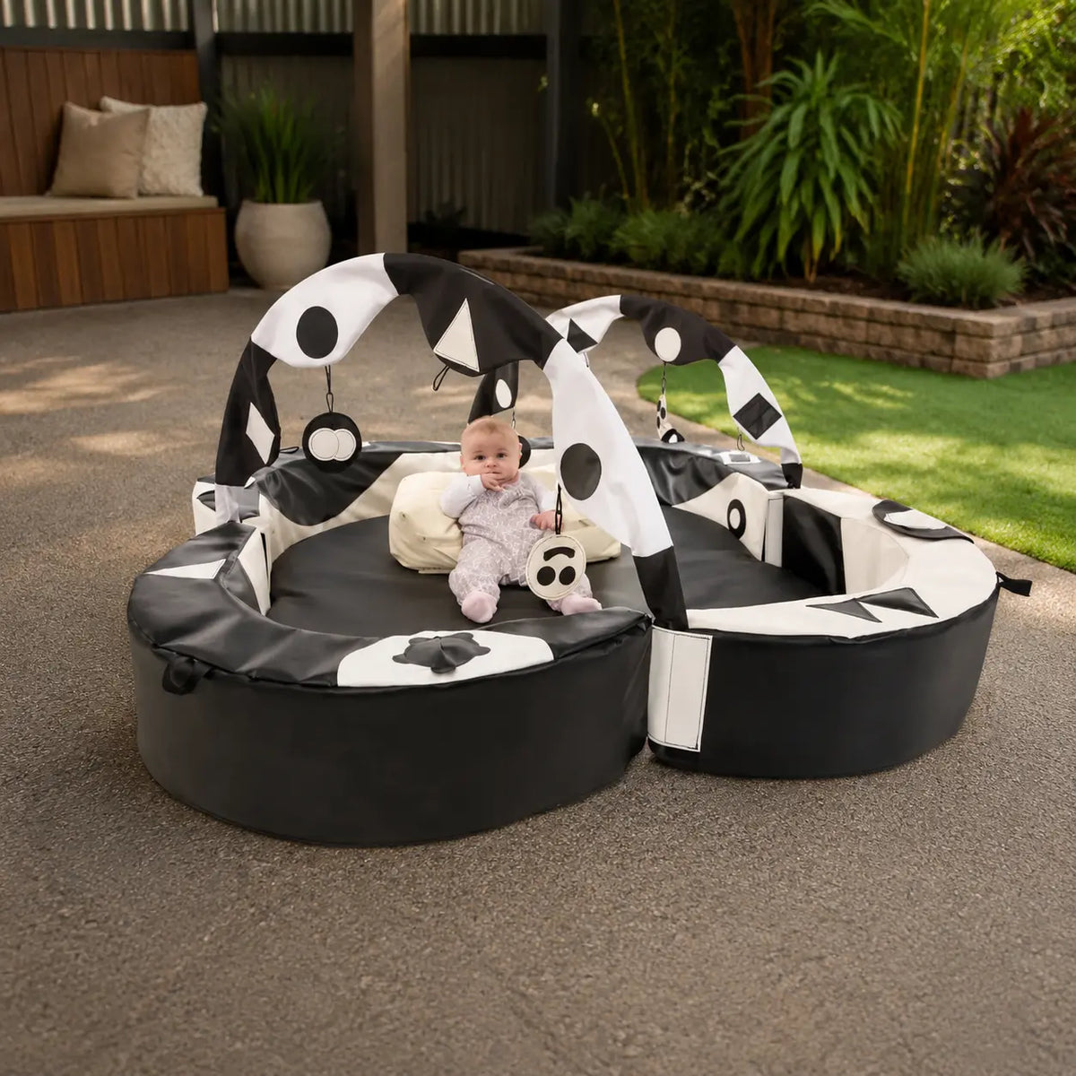 Crescent Ring Super Set Black and White with baby in covered outdoor play area