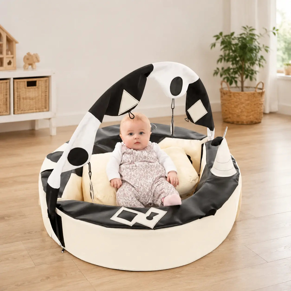Crescent Ring with Activity Arch in a home playroom with baby
