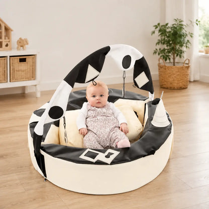 Crescent Ring with Activity Arch in a home playroom with baby