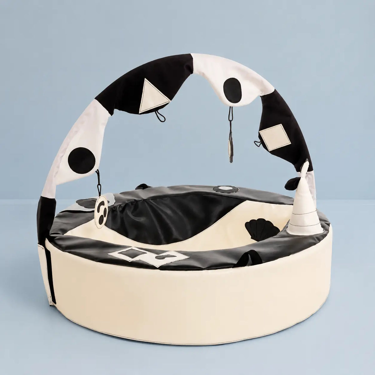 Crescent Ring with Activity Arch in a pale blue studio setting