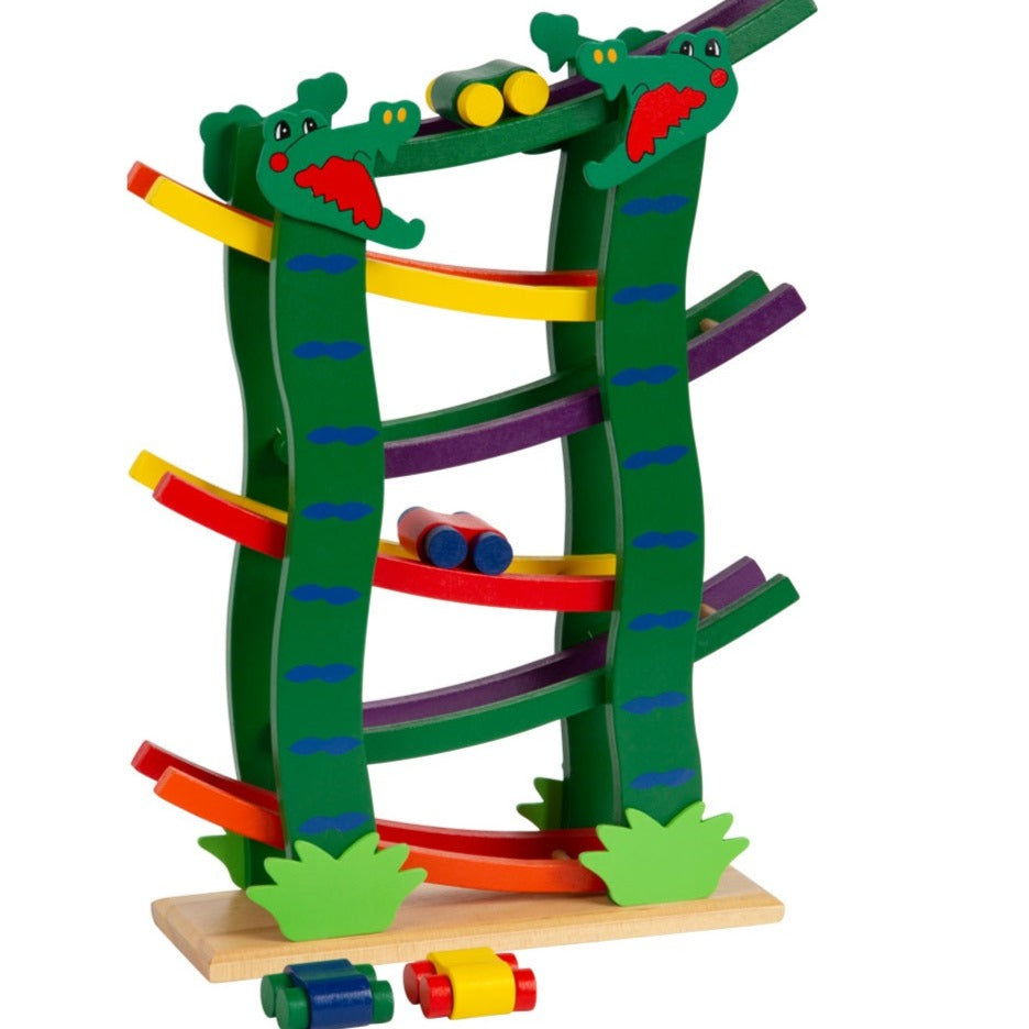 Crocodile Race Track, Introducing our uniquely designed, vibrant Crocodile Wooden Track, inspired by the thrilling dynamics of a marble run! This isn’t just a toy; it’s a journey of speed, excitement, and boundless joy, all woven into a colorfully painted wooden course featuring playful crocodile heads, ready to bite into hours of fun! 🎨 Colorful & Engaging Design: With its colorful track and eye-catching crocodile heads, children are invited to place the included wooden cars on top and watch them zoom and 