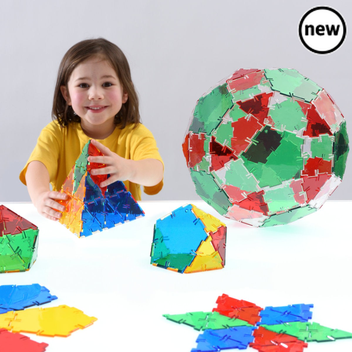 Crystal Polydron Basic Set, The Crystal Polydron Basic Set is a fantastic educational tool that helps children develop spatial awareness and creativity. With its 3 key shapes - squares, equilateral triangles, and pentagons - children can easily construct their first 2D and 3D shapes.This set is perfect for use on a light table or against a light source. By placing the transparent pieces on these surfaces, children can see inside solid structures and gain a better understanding of shape and space. This uniqu