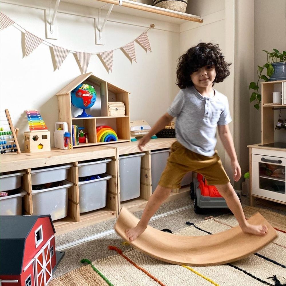 Curvy Balance Board, These Wooden Curvy Balance Boards do exactly what they say on the tin – the simplicity of the idea is what we love. Children can balance on the boards in many different positions – standing, lying or kneeling and when they are done with that, they can use it as a bridge to crawl under or pull their friend across the carpet. Such a simple idea, yet so much fun and so many variables! Your child develops: balancing, coordination, strength, gross motor skills, cognitive development, sensory
