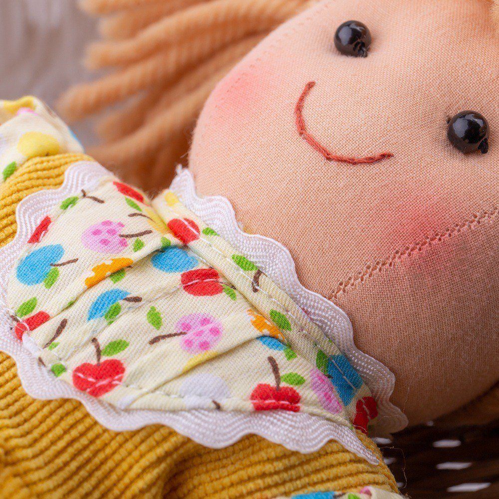 Daisy Doll - Small, Introducing Daisy, the ultimate companion for endless fun and snuggly adventures! This soft and cuddly doll is guaranteed to put a smile on your little one's face. With her perpetually jubilant expression, Daisy is always happy and ready to embark on playful escapades.Daisy's vibrant and colorful outfit perfectly mirrors her sunny and joyous character. Every detail, from her cheerful dress to her radiant accessories, has been carefully designed to reflect her lively personality. Her outf
