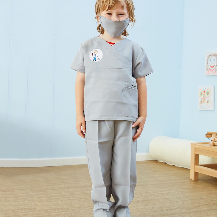 Dentist fancy dress - 5-7 years, This Children's Dentist Costume with Authentic Prints is Ideal for People Who Help Us Role Play and Educational Learning. If your child dreams of one day being a Dentist, this high quality costume from Pretend to Bee is a great way from them to play at it. The 3 piece costume comprises a tunic top with Dentist print logo and pocket, matching trousers with elasticated waist and a face mask. The outfit has everything your child needs to play the part f a young dentist ready to