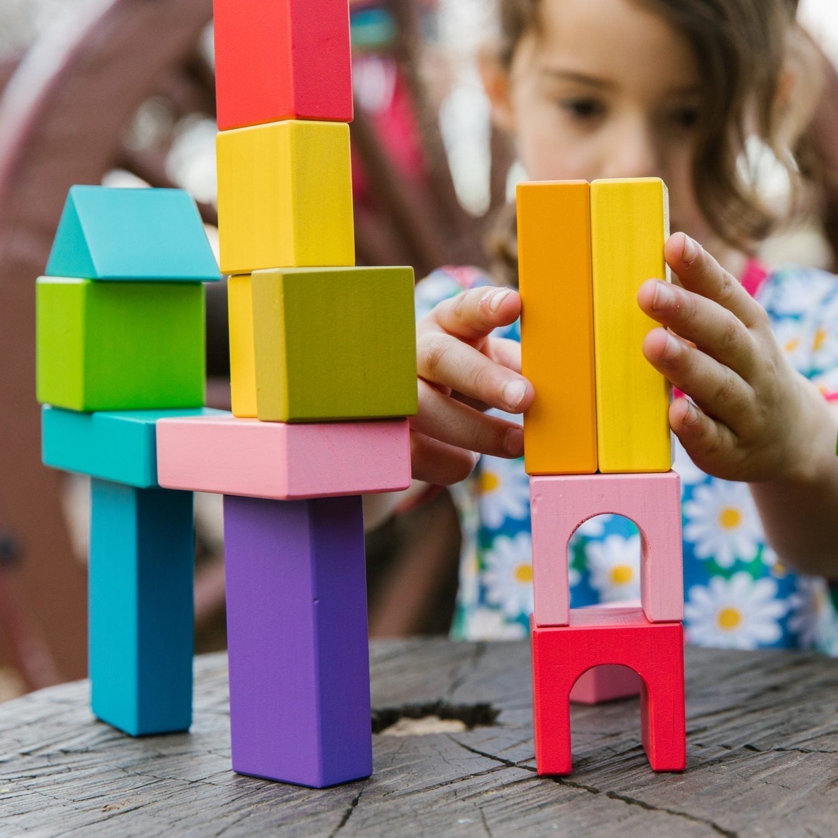 Designer Blocks, Introducing the Wooden Designer Blocks - the perfect building blocks for budding builders! With their beautiful, bright, and sturdy design, these blocks will inspire creativity and create exciting structures.The blocks come in a variety of eye-catching colors, including pink, green, blue, yellow, orange, and more. Each set includes a range of shapes, such as squares, arches, and rods, allowing children to explore and discover new building possibilities.Not only are these blocks fun to play 