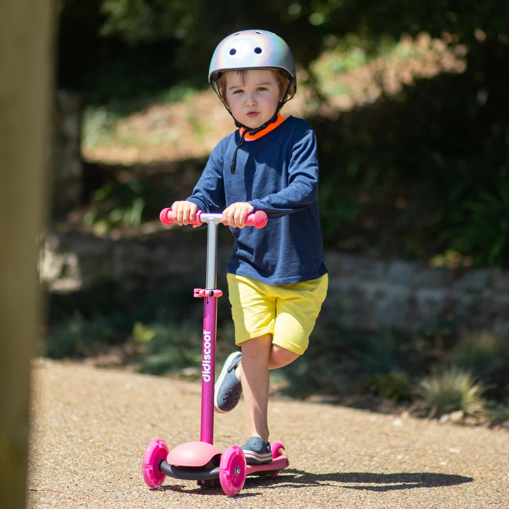 Didiscoot Pink, Enjoy a smooth ride with Didiscoot, a colourful kids 3 wheel scooter. Featuring a modern lean to steer design, it’s easy to ride - simply use your foot to get going! Didiscoot Pink develops children’s confidence, balance and mobility - the three wheels helping to keep them stable and upright. Why is Didiscoot the best scooter for kids? With no pedals or batteries required, it features an adjustable handlebar height (58cm, 67cm and 76cm) to cater for all ages; Didiscoot grows as tall as your 