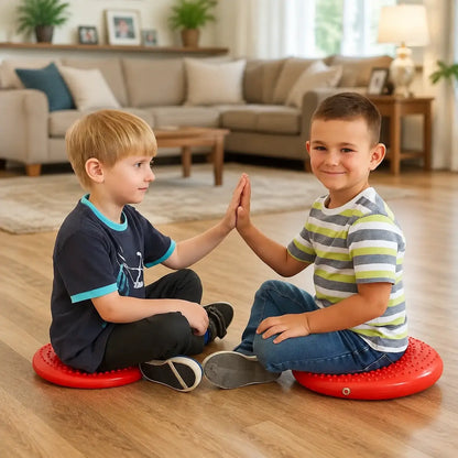 Disc O Sit Junior red inflatable seating cushions used by two children in a family room