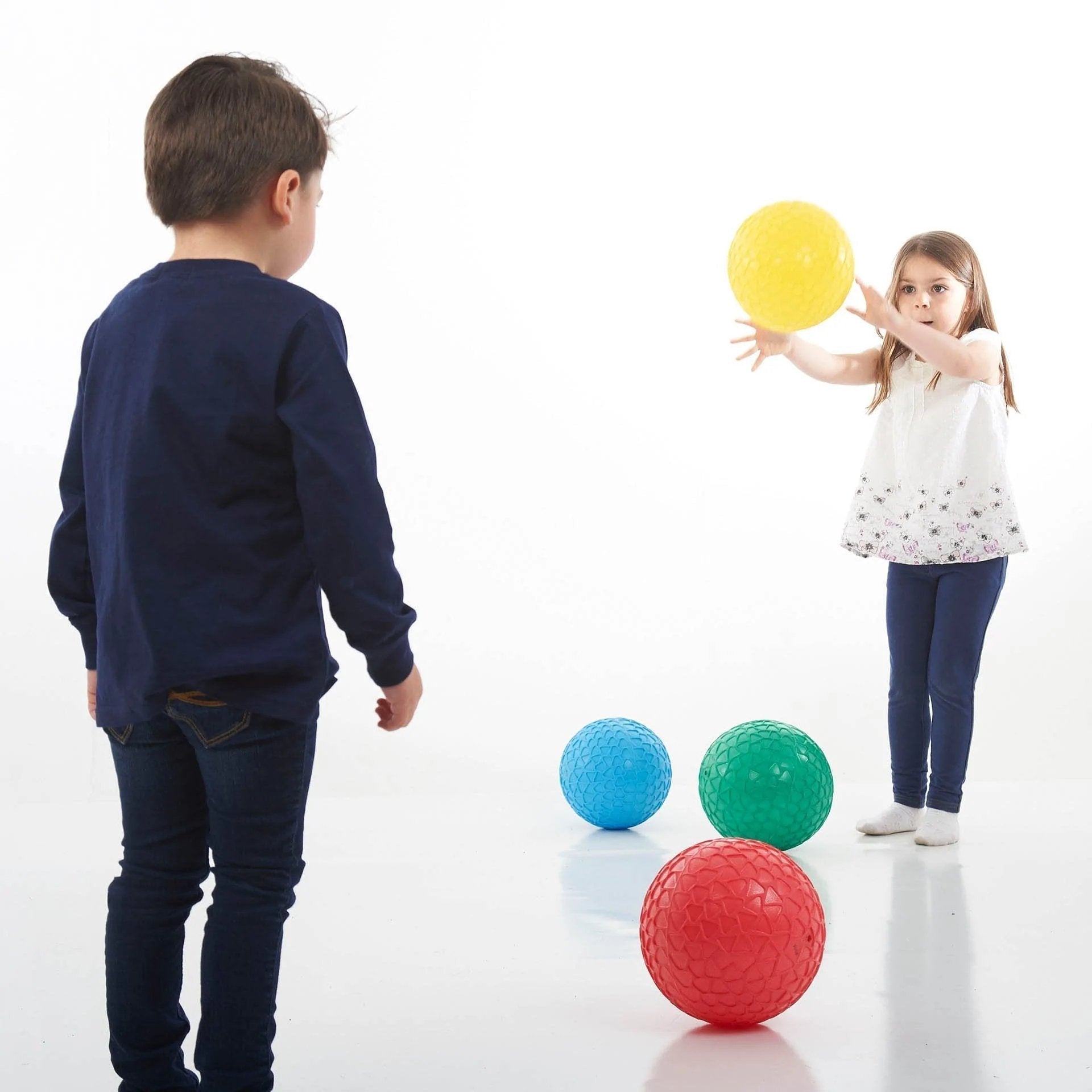 Easy Grip Balls Set - Pk4, The Easy Grip Balls Set is a delightful set of four brightly coloured inflatable Jumbo Easy Grip balls with a honeycomb effect surface which aids grip when catching and throwing. The Easy Grip Balls Set - Pk4 are lightweight but sturdy and a good size for young children to handle.Improves children’s confidence with ball skills and hand-eye coordination.The Easy Grip Balls Set - Pk4 contains ball in Red, green, blue and yellow. Supports the following areas of learning: Physical Dev