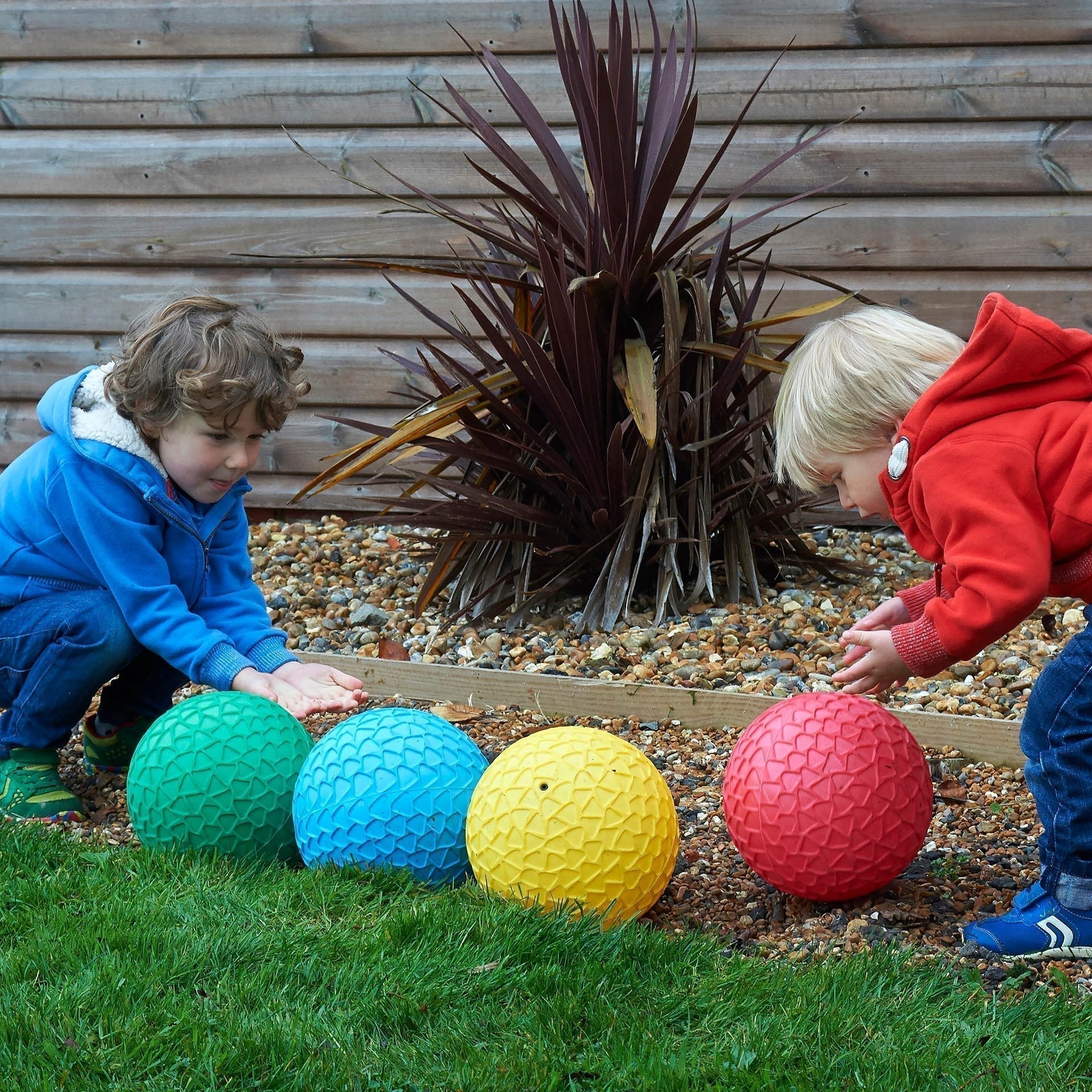 Easy Grip Balls Set - Pk4, The Easy Grip Balls Set is a delightful set of four brightly coloured inflatable Jumbo Easy Grip balls with a honeycomb effect surface which aids grip when catching and throwing. The Easy Grip Balls Set - Pk4 are lightweight but sturdy and a good size for young children to handle.Improves children’s confidence with ball skills and hand-eye coordination.The Easy Grip Balls Set - Pk4 contains ball in Red, green, blue and yellow. Supports the following areas of learning: Physical Dev