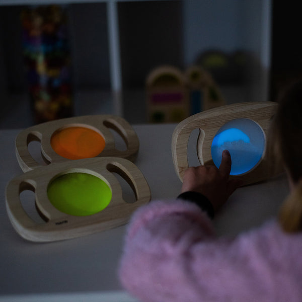 Easy Hold Glow Panel Blue, The Easy Hold Glow Panel Blue is new to our best-selling Easy Hold range, this beautiful rubberwood frame with easy grip handles contains a fascinating glow in the dark panel. The Easy Hold Glow Panel Blue is activated by leaving in bright light, when taken into a dark den it magically glows in vibrant blue. Children will love to watch the glowing liquid swirl and flow as they twist and turn the panel. The luminescent blue panel offers a new magical, vibrant and sensory perspectiv