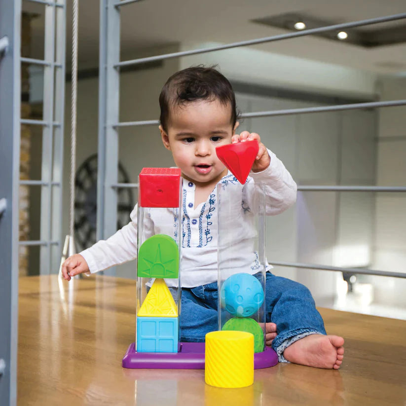 Edushape Geostacker, Introducing the Edushape Geostacker Stack and Sort - a captivating and educational toy designed to engage and delight your little one as they embark on a journey of discovery through geometric shapes and stacking fun! This set includes eight classic geometric shapes that are not only enjoyable for babies to hold and squeeze, but also perfect for stacking on top of each other. With topple-proof tubes, you can watch your baby's excitement soar as they create impressive structures, promoti