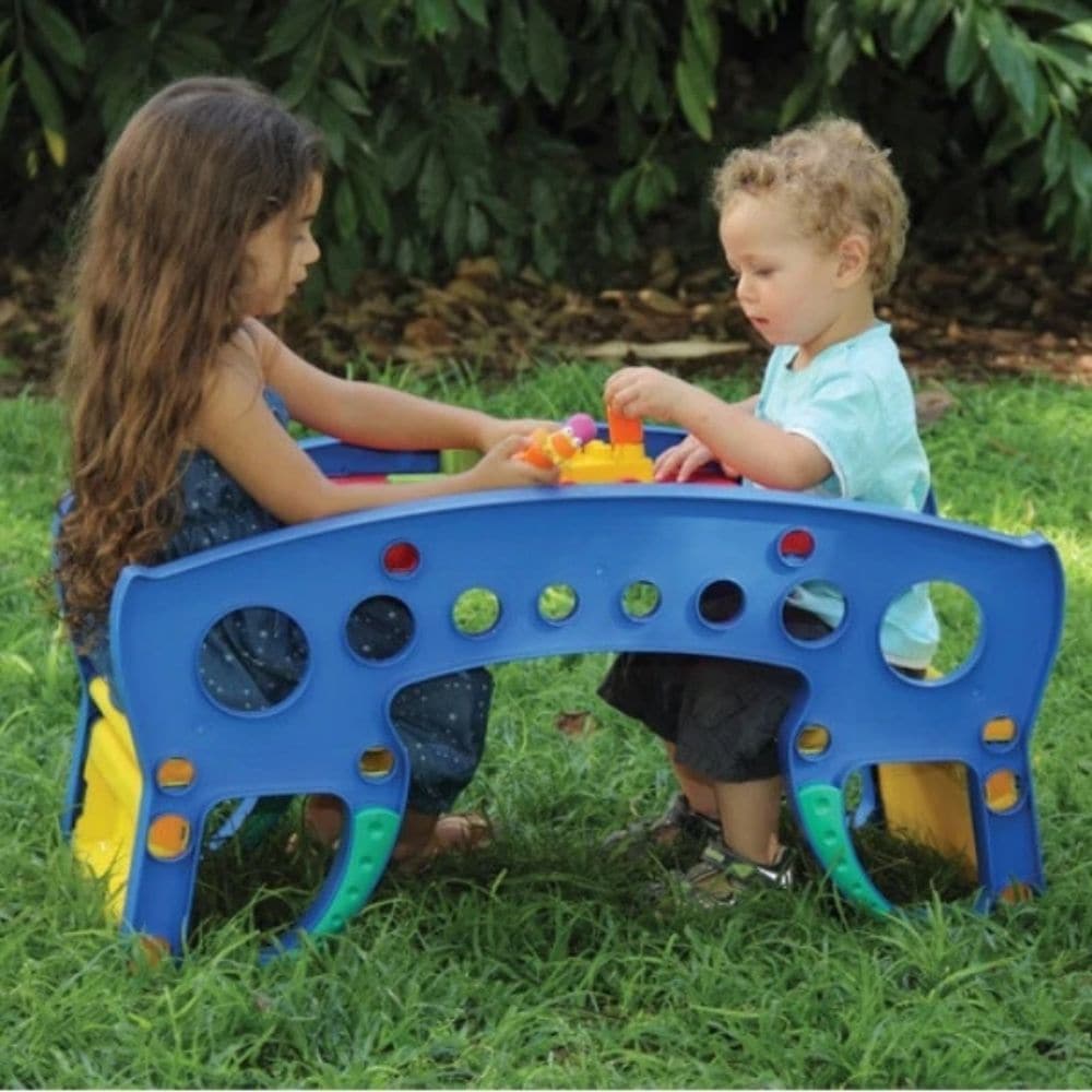 Edushape Rock n Table, The Edushape Rock 'n' Table is a versatile activity table designed to keep children entertained and active, no matter where they are! With its charming design and bright colors, this table is sure to delight children and spark their imagination. This Edushape Rock n Table is perfect for toddlers, but it is also sturdy enough to withstand the rough play of young children. With its unique design, the table can be easily transformed into a seesaw, providing children with a fun and challe