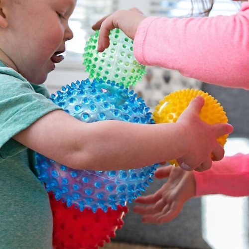 Edushape Sensory Ball Mega Pack, Introducing the Edushape Sensory Ball Mega Pack - a set of four uniquely textured, multi-colored balls designed to stimulate your child's senses and foster their development. These sensory balls are not just toys, but tools that help enhance tactile and visual sensory awareness, gross and fine motor skills, hand-eye coordination, and socialization.Each ball in the Edushape Sensory Ball Mega Pack features a distinct, nubby texture that is intriguing to touch and explore. When