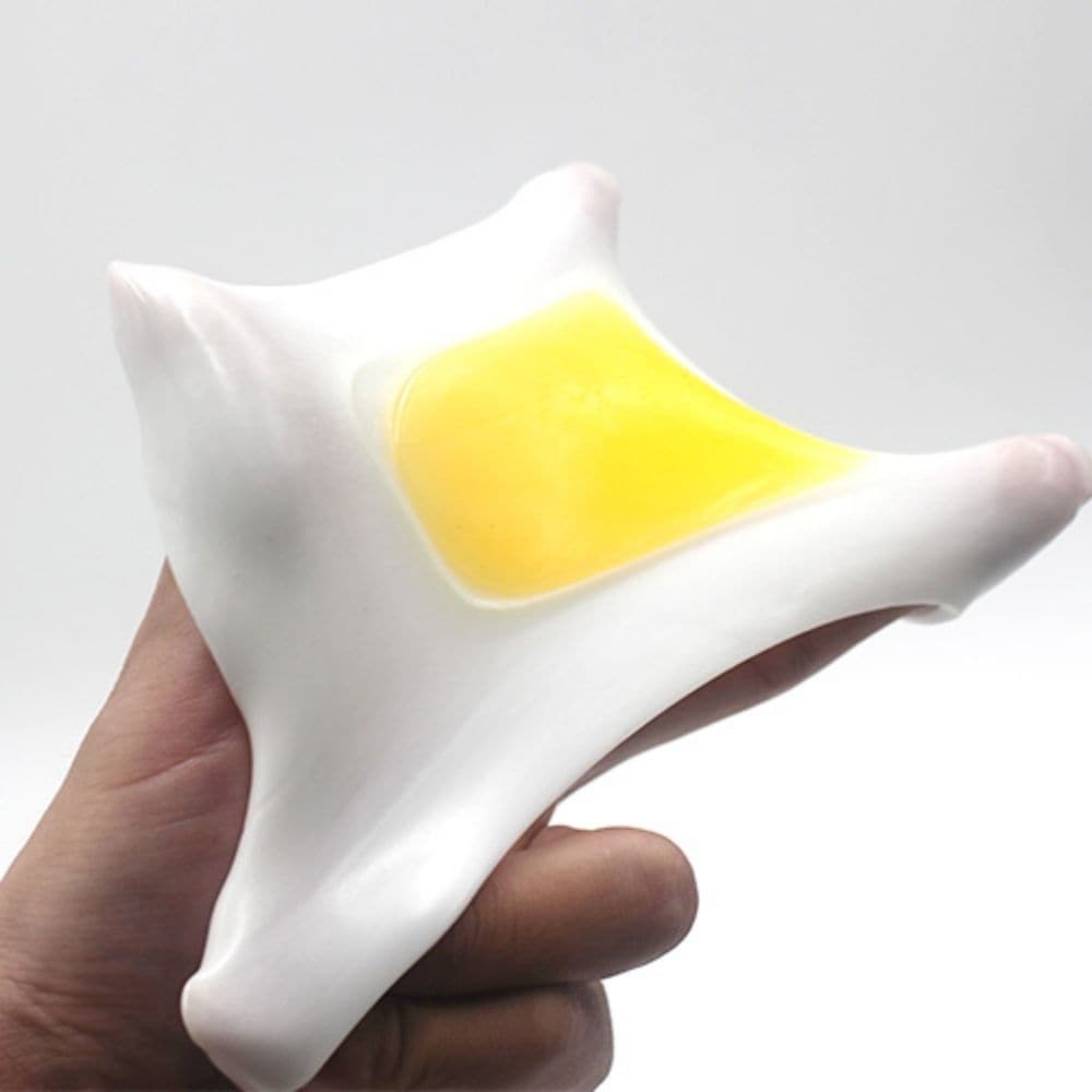 Egg Squeezing Venting Toy, The Egg Squeezing Venting Toy is the ultimate stress relief tool that is sure to soothe your nerves. Made of soft and flexible rubber, this unique stress ball will provide endless hours of tactile entertainment. When you squeeze it, a realistic looking egg yolk will appear in your hand, giving you the feeling of actually holding an egg in your palm.Its rubbery texture makes it comfortable to hold and the egg yolk adds a fun element to your stress relief routine. Not only is it a g