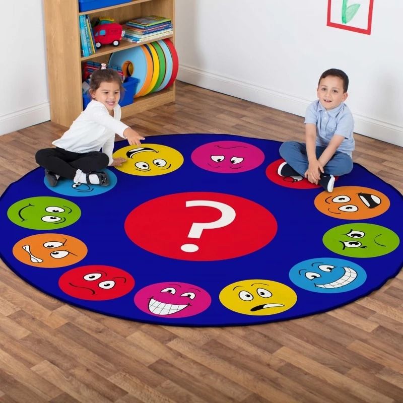 Emotions Faces Circular Carpet, This highly visual Emotions Faces Circular Carpet has 12 different emotional/feelings expressions to encourage group discussion about feelings and interaction. The Emotions Faces Circular Carpet brings colour and character into any classroom or early years settings and provides the perfect resource to talk about emotions and facial expressions. The Emotions Faces Circular Carpet is a hugely popular resource within SEN school placements. 2m circular carpet featuring 12 differe