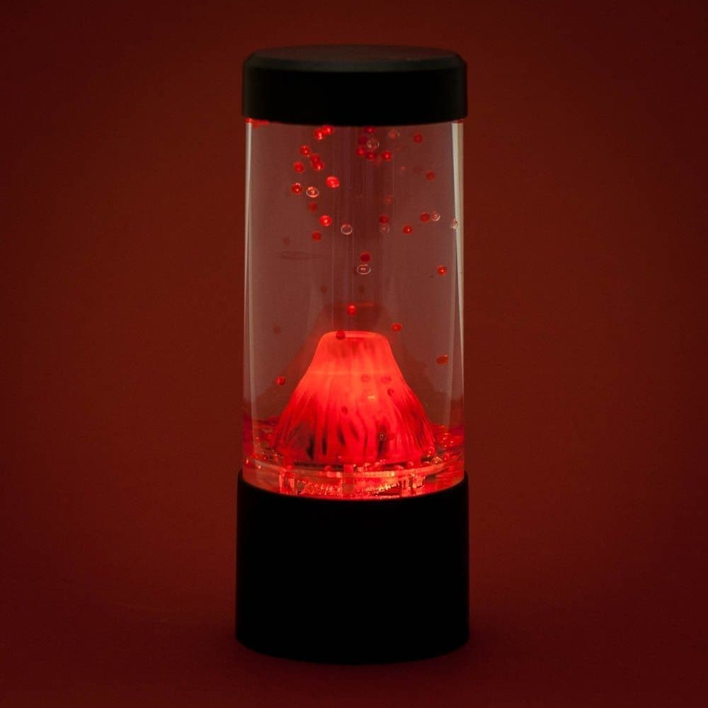 Explosion Volcano Lamp, Embrace the mesmerizing beauty of the Explosion Volcano Lamp and enhance the ambience of any space. Designed for those who appreciate the allure of novelty night lights, this Round Volcano Lamp is a delightful addition to your bedside table, home office desk, or even a child's bedroom.With its cylindrical design, this lamp effectively simulates a volcano, creating a captivating visual display. When turned on, watch as red beads flow out of the top of the volcano, as if it were erupti