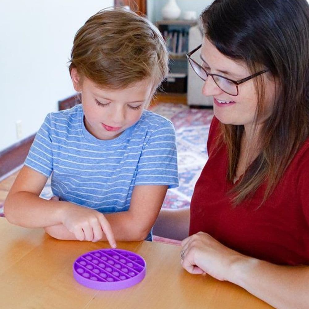 Fidget Bubble Popper, This Fidget Bubble Popper is a great sensory tool you will fidget with again and again. If ever you have enjoyed popping the bubble wrap right out of the box or package, then you'll love this bubble fidget. Divert a busy mind, with this reusable bubble wrap alternative. It makes a much, much quieter, but still satisfying pop! Place all the buttons down, then flip it over and do it again. Suitable for home and classrooms, without driving the teacher and parents mad! Simply press the mou