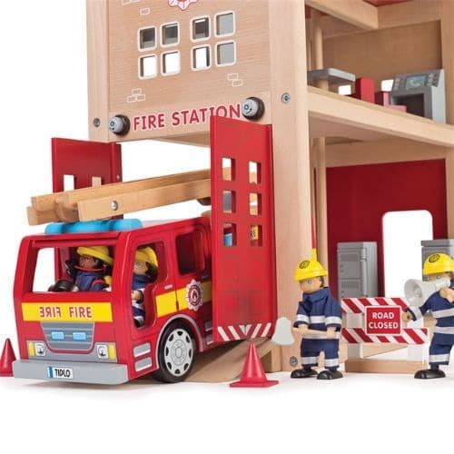 Fire Station Set, Spark imaginative play with this delightful wooden Fire Station from Tidlo. Perfect for any budding young firefighter, this extensive set features a firefighters pole, a sloping ramp and swing open doors, two lockers, a table, three chairs, a dispatch desk and bunk bed. Send the fire fighters (sold separately) into action by whizzing them down the pole. The firefighters can then jump into the fire engine (sold separately), before making a swift exit down the sloping ramp and through the sw