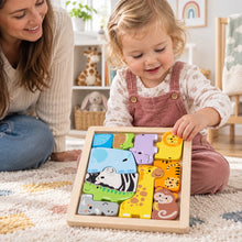 Child completing the Fisher-Price Wooden Animal Puzzle