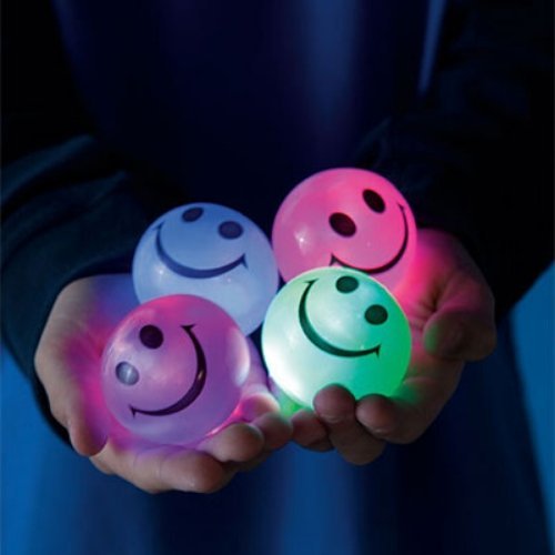 Flashing smiley face balls, Introducing the Flashing Smiley Face Ball, the epitome of fun-packed into a vibrantly coloured, soft and rubbery sphere. With a design that captivates, it promises not just a game, but an experience that glows. Features to Smile About: Light Up the Fun: Bounce, hit, or roll the ball to bring it to life, revealing a radiant display of LED flashing lights inside. The smiley face design adds an extra layer of charm, making each play session even more delightful. Day or Night: This b